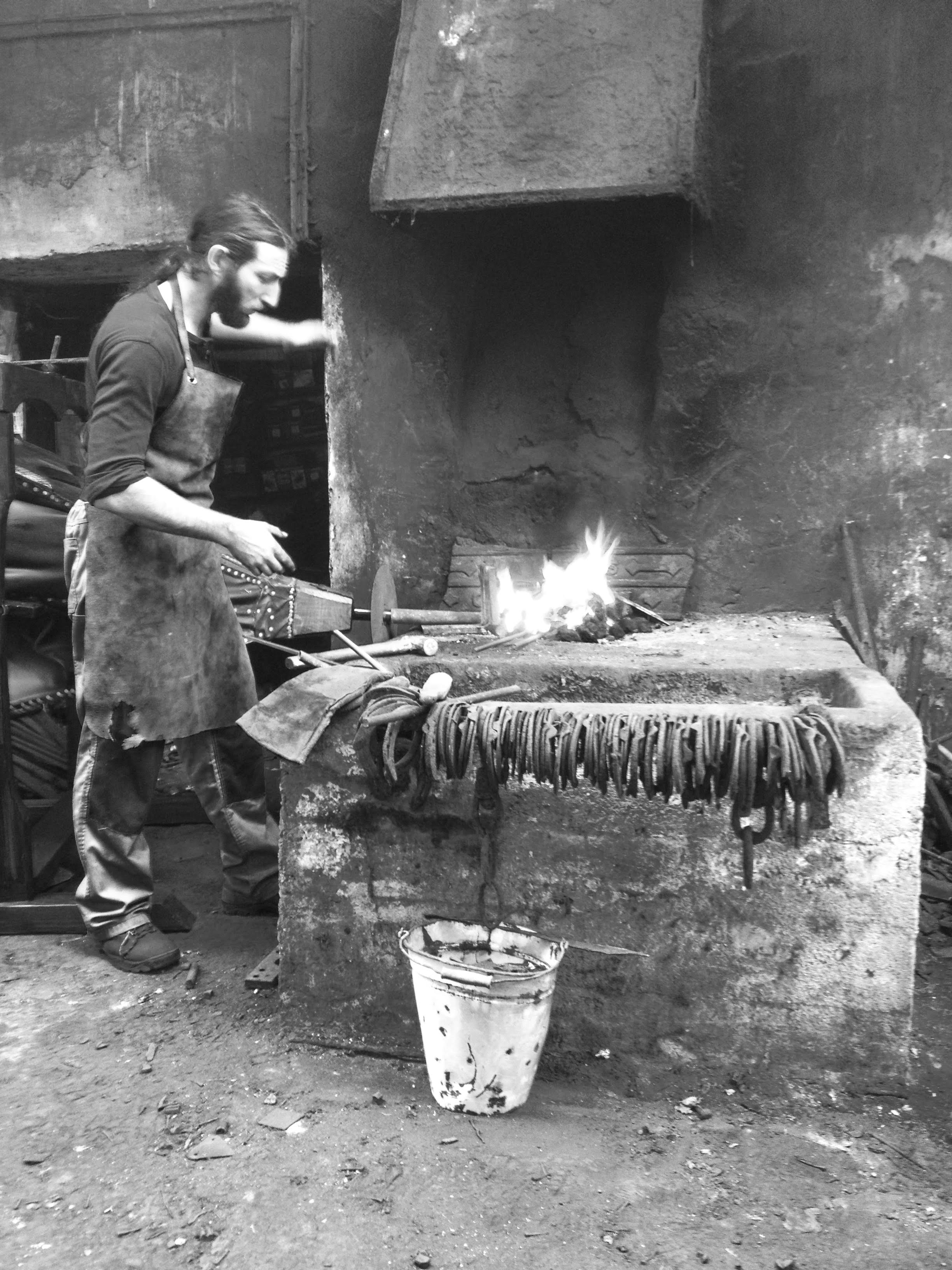Swordsmith demonstrating forging techniques